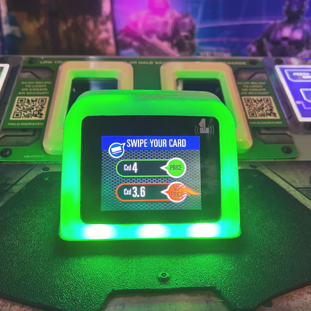 Green Game Play card reader showing a green LED light around the display screen.